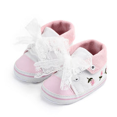 Exquisite baby girl dress featuring elegant white lace detailing for a luxurious touch.