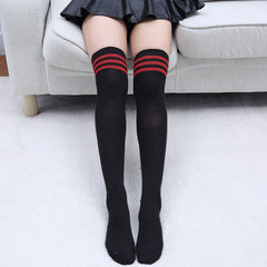 Elegant style striped stockings accentuating sophisticated fashion choices.