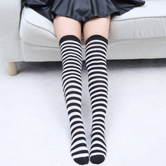 Elegant style striped stockings accentuating sophisticated fashion choices.