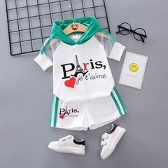Stylish summer outfits for kids, featuring tailored suits suitable for warm weather occasions.