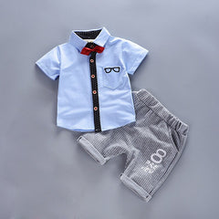 Stylish summer outfits for kids, featuring tailored suits suitable for warm weather occasions.