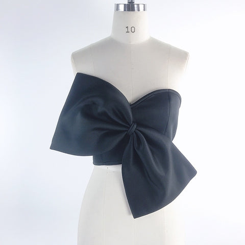 Solid color sexy bow detail on elegant dress, enhancing style and sophistication for fashionable outfits.
