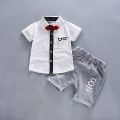 Stylish summer outfits for kids, featuring tailored suits suitable for warm weather occasions.