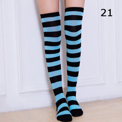 Elegant style striped stockings accentuating sophisticated fashion choices.