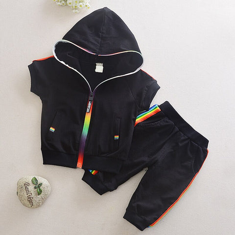 Stylish summer outfits for kids, featuring tailored suits suitable for warm weather occasions.