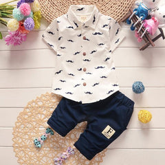 Stylish summer outfits for kids, featuring tailored suits suitable for warm weather occasions.