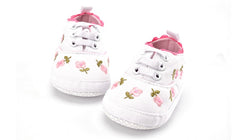 Exquisite baby girl dress featuring elegant white lace detailing for a luxurious touch.