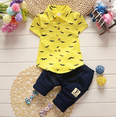 Stylish summer outfits for kids, featuring tailored suits suitable for warm weather occasions.