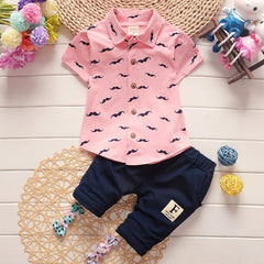 Stylish summer outfits for kids, featuring tailored suits suitable for warm weather occasions.