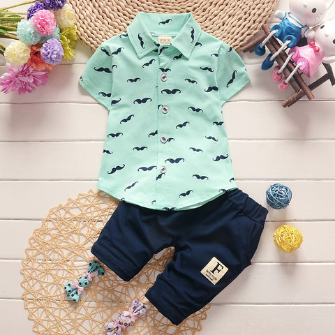 Stylish summer outfits for kids, featuring tailored suits suitable for warm weather occasions.