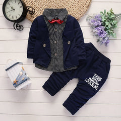 Stylish children's clothing displayed on hangers in a boutique, showcasing vibrant colors and trendy designs.