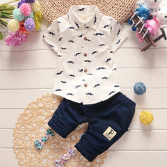 Stylish summer outfits for kids, featuring tailored suits suitable for warm weather occasions.