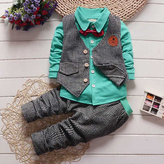Stylish children's clothing displayed on hangers in a boutique, showcasing vibrant colors and trendy designs.
