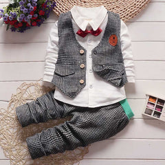 Stylish children's clothing displayed on hangers in a boutique, showcasing vibrant colors and trendy designs.
