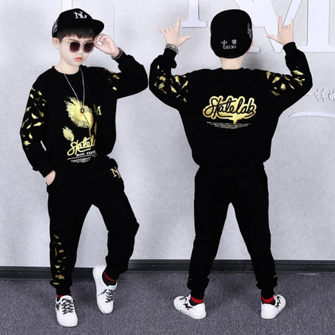 Elegant boys' sport suit designed for formal occasions and athletic events, combining style with comfort.
