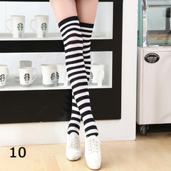 Elegant style striped stockings accentuating sophisticated fashion choices.