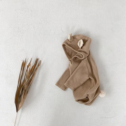 Infant girls’ bodysuit with bunny ear design, perfect for stylish and adorable baby outfits.