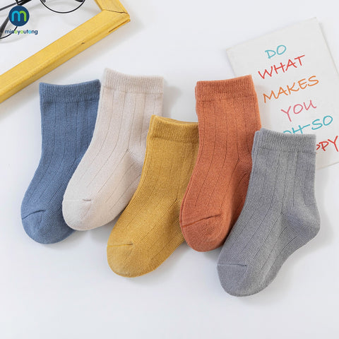 Colorful multi-colored autumn socks displayed together, showcasing warmth and style for the fall season.