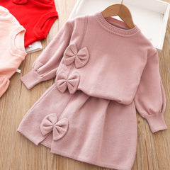 Elegant winter sweater paired with a stylish tulle dress, perfect for seasonal fashion ensembles.