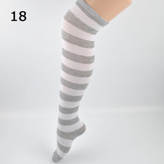 Elegant style striped stockings accentuating sophisticated fashion choices.