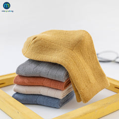 Colorful multi-colored autumn socks displayed together, showcasing warmth and style for the fall season.