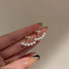 Elegant metal earrings featuring a modern design, perfect for enhancing any formal attire.