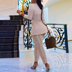 Elegant houndstooth blazer showcasing timeless fashion for sophisticated dressing in any occasion.