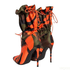 A pair of stylish high heels paired with elegant calf boots for a sophisticated footwear collection.