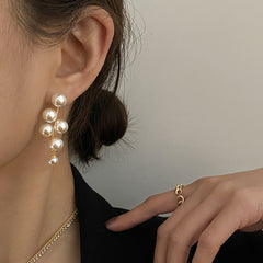 Elegant metal earrings featuring a modern design, perfect for enhancing any formal attire.