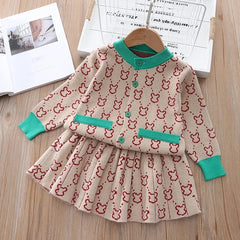 Elegant winter sweater paired with a stylish tulle dress, perfect for seasonal fashion ensembles.