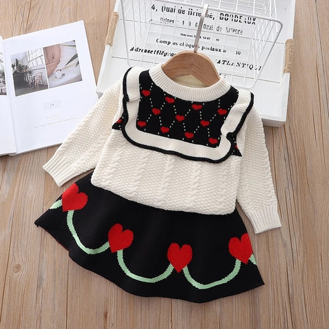 Elegant winter sweater paired with a stylish tulle dress, perfect for seasonal fashion ensembles.