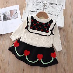 Elegant winter sweater paired with a stylish tulle dress, perfect for seasonal fashion ensembles.