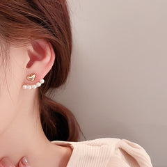 Elegant metal earrings featuring a modern design, perfect for enhancing any formal attire.