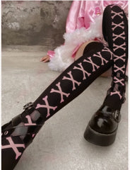 Goth fishnet tights featuring intricate patterns, perfect for adding an edgy flair to any outfit.
