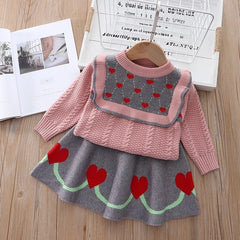 Elegant winter sweater paired with a stylish tulle dress, perfect for seasonal fashion ensembles.