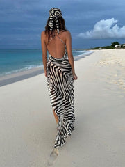 Elegant spaghetti strap beach dress, perfect for summer outings and seaside vacations.