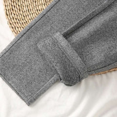 Luxurious woolen fabric showcasing elegant textures and rich colors in a refined setting.