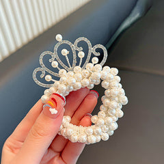 Elegant pearl crown showcasing exquisite fashion design and craftsmanship, perfect for regal occasions.