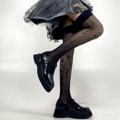 Goth fishnet tights featuring intricate patterns, perfect for adding an edgy flair to any outfit.