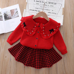 Elegant winter sweater paired with a stylish tulle dress, perfect for seasonal fashion ensembles.