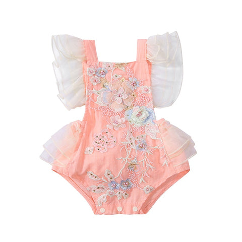 Elegant ruffle sleeve blouse featuring intricate floral embroidery for a sophisticated look.
