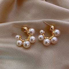 Elegant metal earrings featuring a modern design, perfect for enhancing any formal attire.