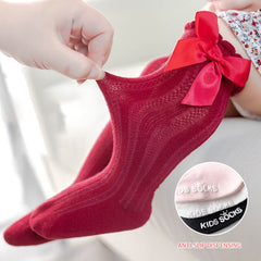 Knee high classy formal dress featuring a big bow, perfect for elegant occasions and sophisticated events.