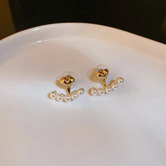 Elegant metal earrings featuring a modern design, perfect for enhancing any formal attire.