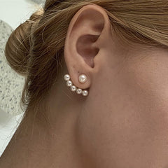 Elegant metal earrings featuring a modern design, perfect for enhancing any formal attire.