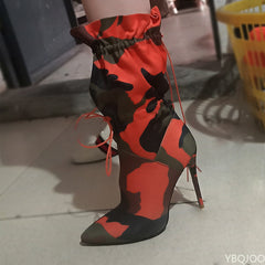 A pair of stylish high heels paired with elegant calf boots for a sophisticated footwear collection.