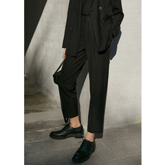 Elegant high waist trousers showcasing a sophisticated silhouette for a polished look.