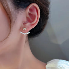Elegant metal earrings featuring a modern design, perfect for enhancing any formal attire.
