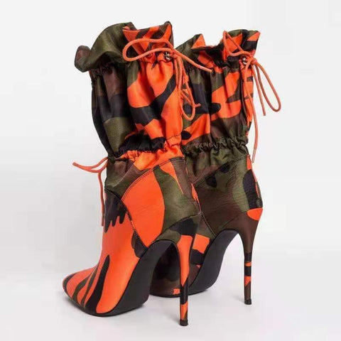 A pair of stylish high heels paired with elegant calf boots for a sophisticated footwear collection.