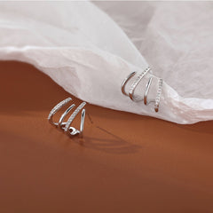 Elegant metal earrings featuring a modern design, perfect for enhancing any formal attire.